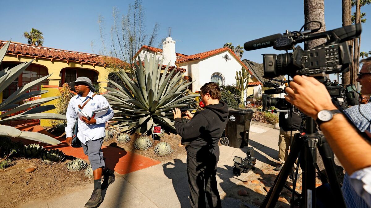 Camera crews set up outside of the home of Meghan Markle's mother in Los Angeles on Monday.