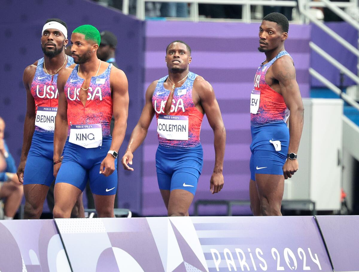 Kenneth Bednarek, Kyree King, Christian Coleman and Fred Kerley look down the track after getting disqualified 