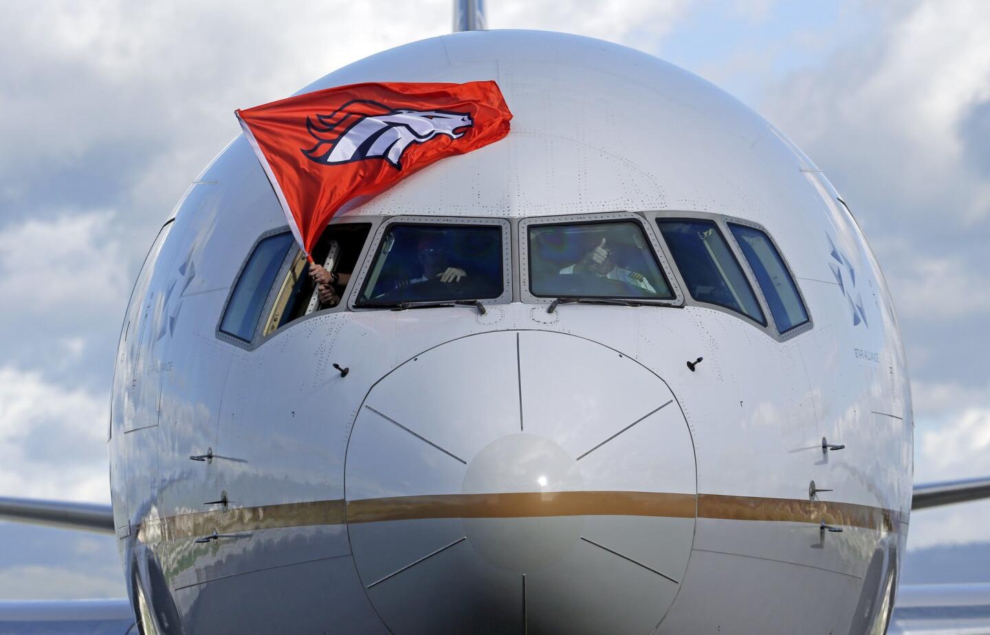 The plane carrying the Denver Broncos arrives at Mineta San Jose International Airport for the NFL Super Bowl football game Sunday, Jan. 31, 2016, in San Jose, Calif. The Broncos play the Carolina Panthers on Sunday, Feb. 7, 2015, in Super Bowl 50. (AP Photo/Charlie Riedel)