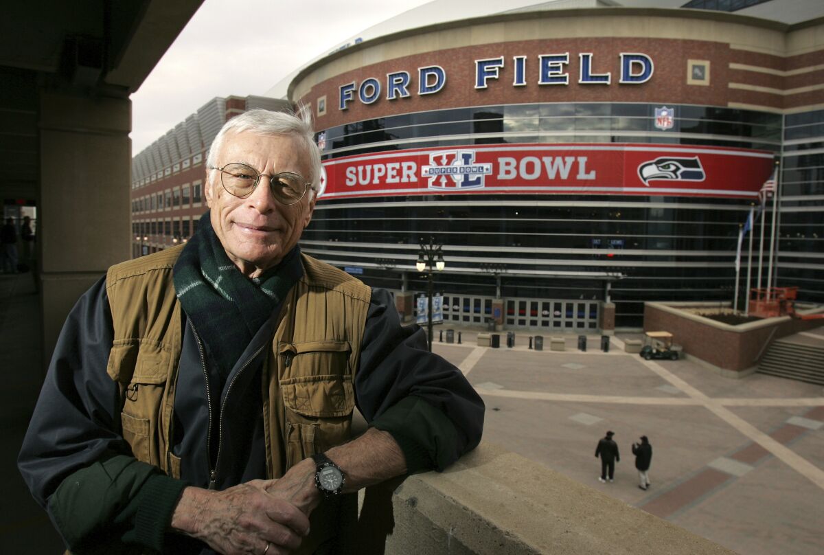 Sports writer Jerry Green poses across from Ford Field on Jan. 28, 2006, in Detroit. Green, a Detroit sports writer who covered 56 consecutive Super Bowls, died Thursday night, March 23, The Detroit News said Friday, March 24, 2023. He was 94. Green retired as a columnist at the News in 2004 but continued to attend the Super Bowl for the newspaper until this year. His streak began with Green Bay's 35-10 victory over Kansas City in the first Super Bowl in 1967. (Daniel Mears/Detroit News via AP)