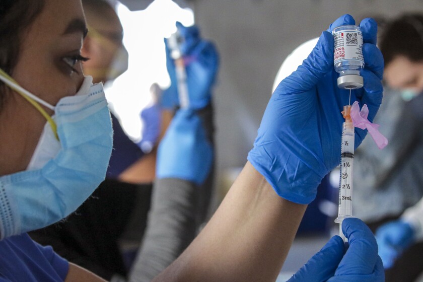 A nurse prepares a COVID-19 vaccine dose in Fontana on Feb. 2. 