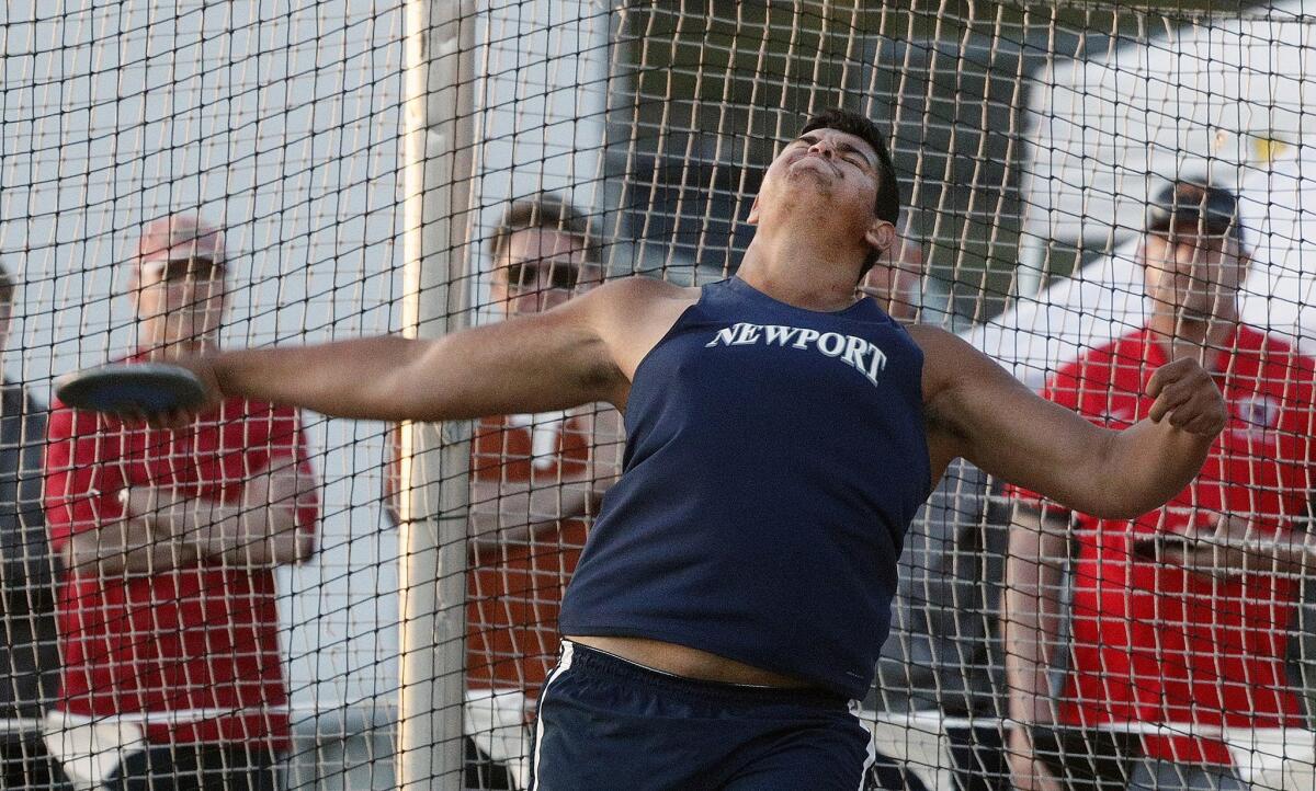 Newport Harbor's Aidan Elbettar throws the discus at the Arcadia Invitational on April 6.