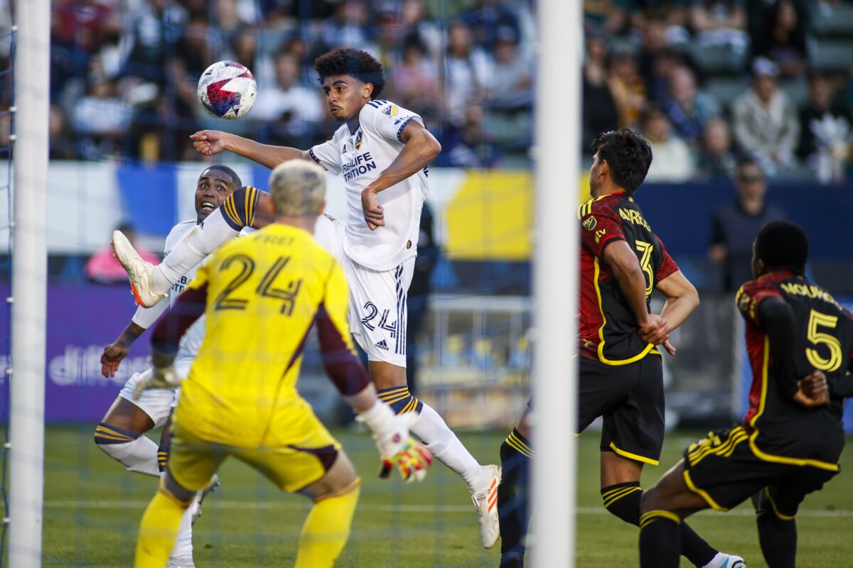 The Galaxy's Jalen Neal controls the ball while Sounders goalkeeper Stefan Frei (24) defends in the second half on April 1, 2023.