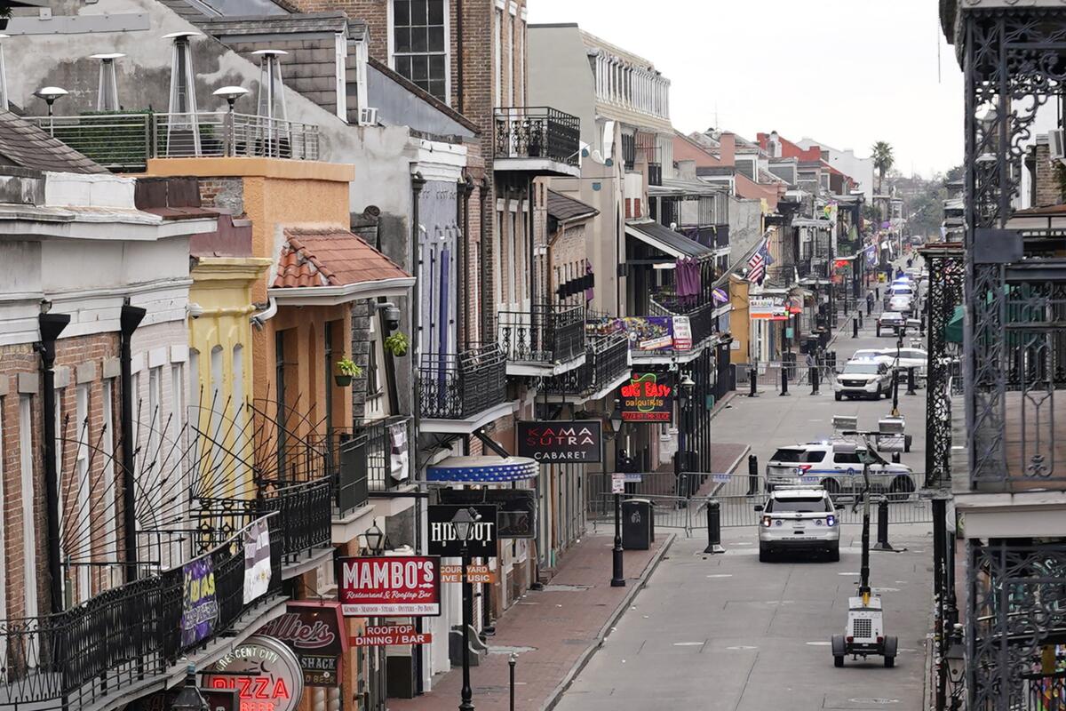 Bourbon Street is blocked by vehicles and barricades in New Orleans