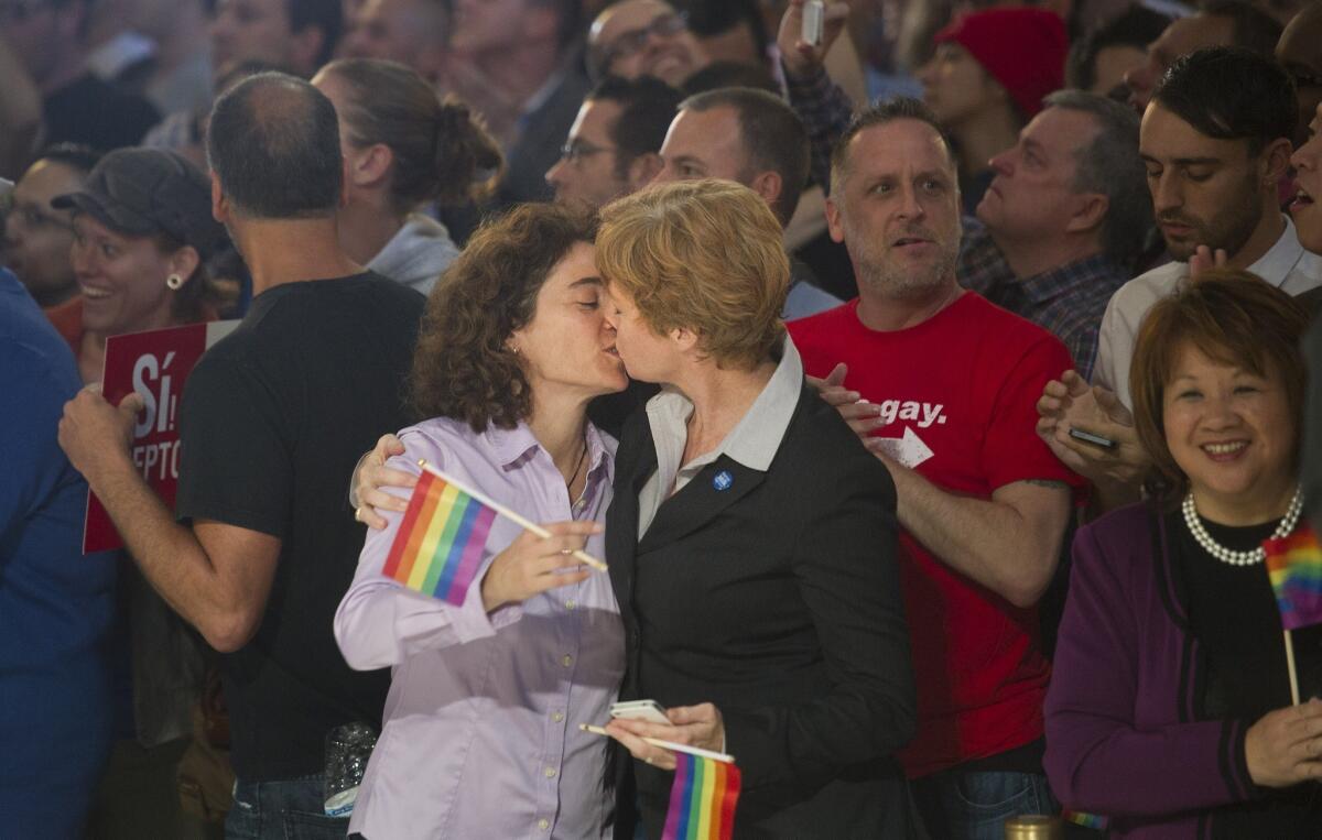 Married couple Pam Grey, left, and Zoe Dunning kiss to celebrate the U.S. Supreme Court's ruling on Proposition 8 at San Francisco's City Hall on Wednesday.