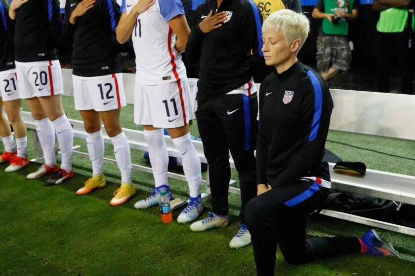 ATLANTA, GA - SEPTEMBER 18: Megan Rapinoe #15 kneels during the National Anthem prior to the match between the United States and the Netherlands at Georgia Dome on September 18, 2016 in Atlanta, Georgia. (Photo by Kevin C. Cox/Getty Images) ** OUTS - ELSENT, FPG, CM - OUTS * NM, PH, VA if sourced by CT, LA or MoD **