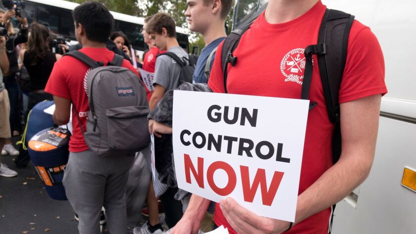 Students from Marjory Stoneman Douglas High School in Parkland, Fla., hold signs appealing to Florida legislators to pass gun-control laws.