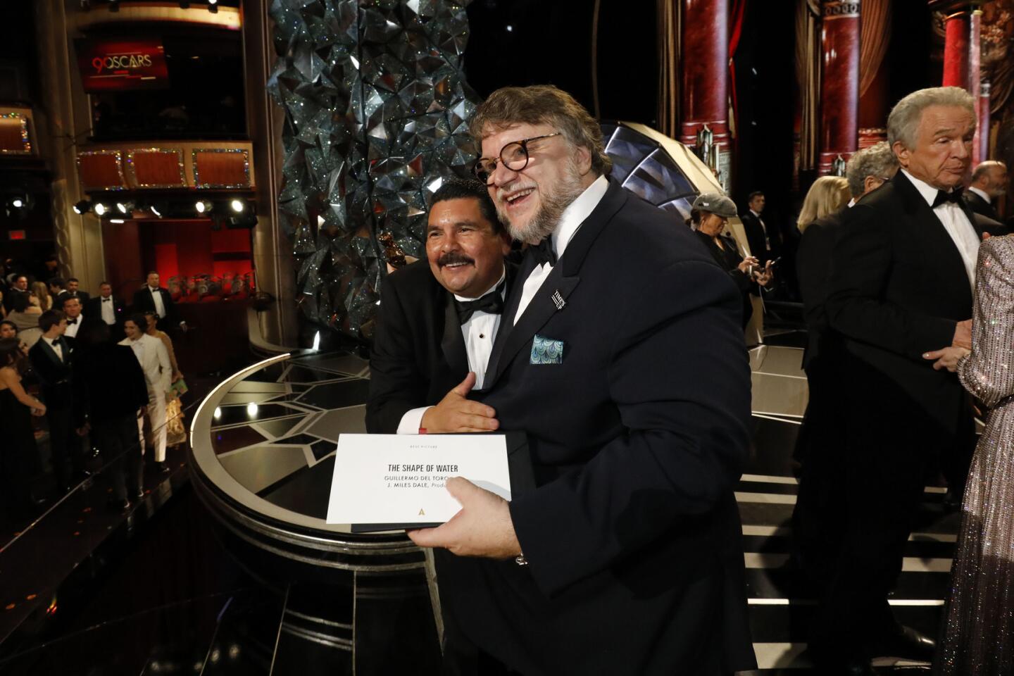 Oscar winner Guillermo Del Toro poses with Jimmy Kimmel pal Guillermo Rodriguez at the 90th Academy Awards.