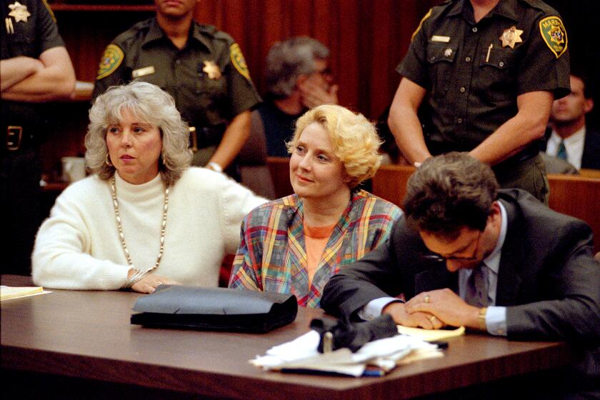 JTM_Broderick009958_12/10/1991_San Diego, CA_THE VERDICT: BETTY BRODERICK (middle) smiles as the jury reads its verdict. Her attorney, JACK EARLEY (right), reacts differently to the news._San Diego Union-Tribune photograph by J.T. MacMILLAN