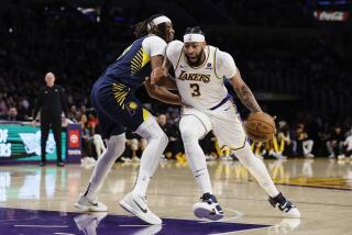 Los Angeles Lakers forward-center Anthony Davis (3) dribbles past Indiana Pacers.