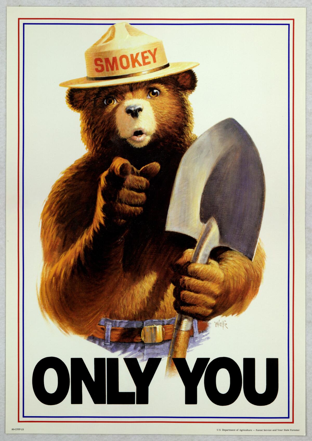 A poster of a bear holding a shovel and wearing a hat that says "Smokey" on it.
