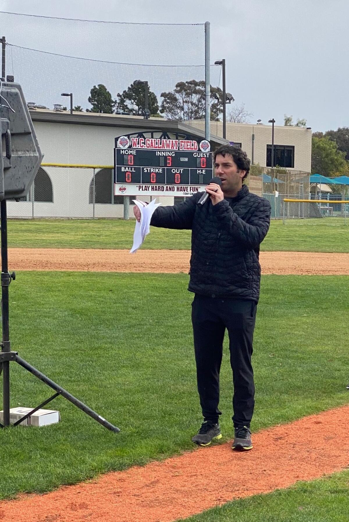 La Jolla Youth Baseball President Scott Blumenthal speaks during the league's 70th opening day ceremony March 5.