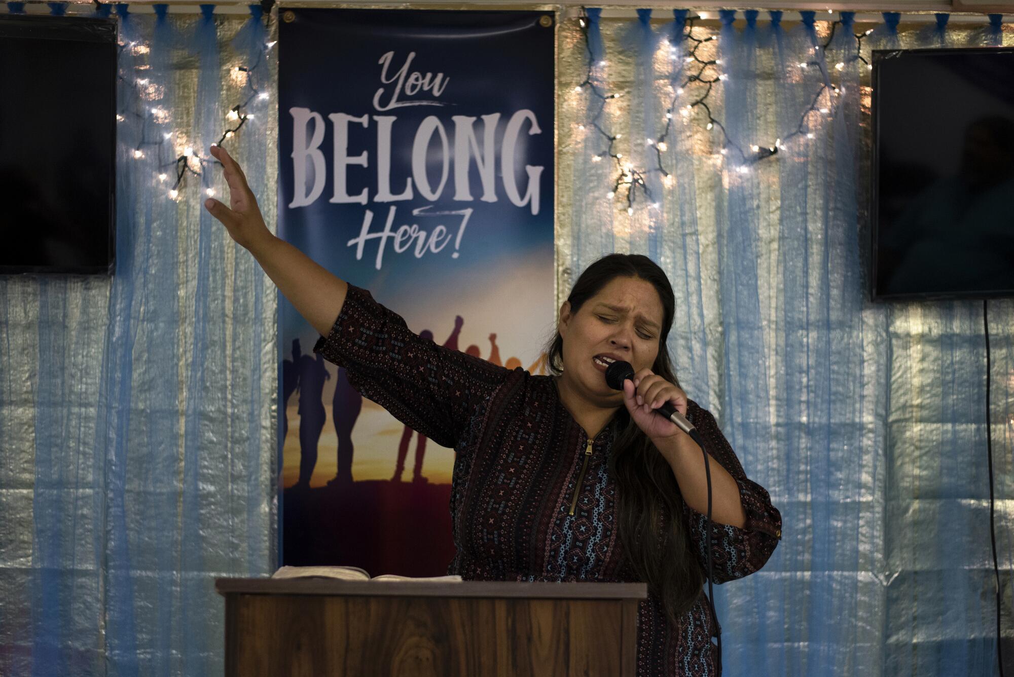Silva preaches to the congregation at the small community church she leads.