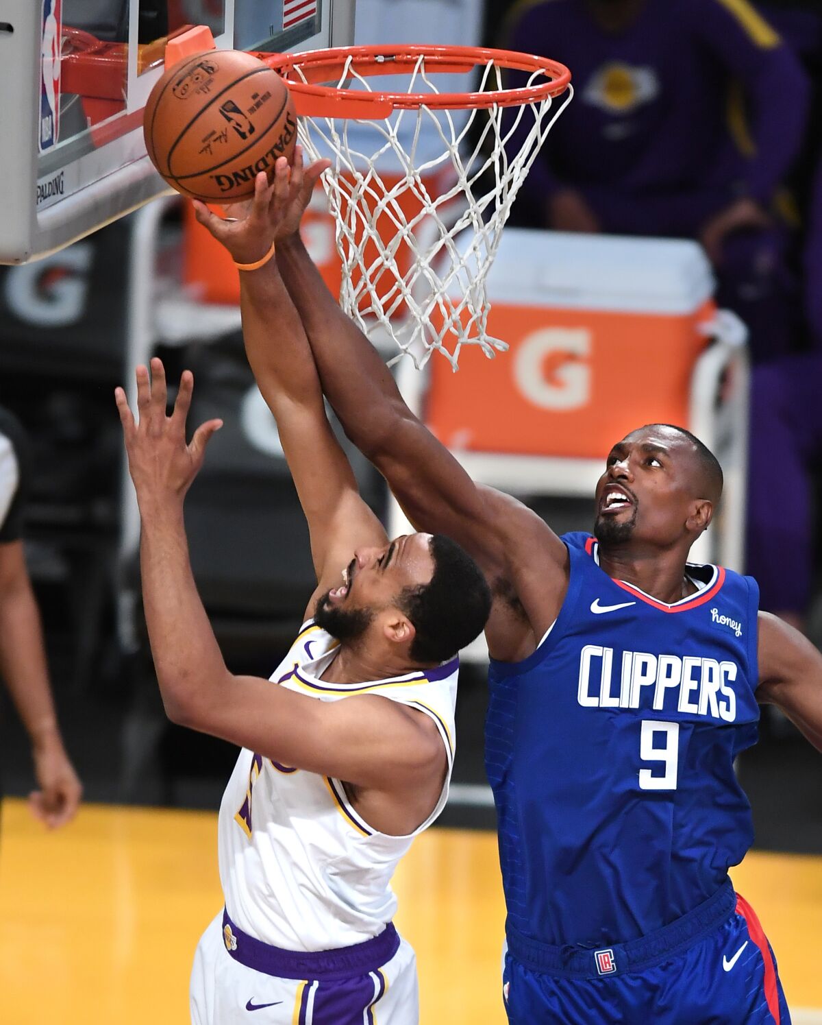 Clippers center Serge Ibaka blocks a shot by Lakers guard Talen Horton-Tucker.