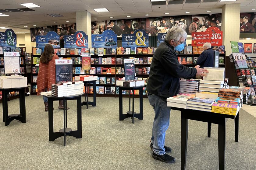 Customers shop for books at a Barnes and Noble store in Corte Madera, California.