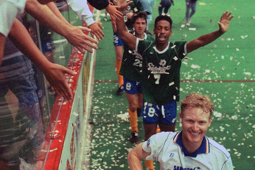 Paul Dougherty leads a parade of San Diego Sockers, some wearing the losing team's jersey as part of a tradition, in a victory lap around the Sports Arena. The Sockers won their fifth consecutive Major Soccer League championship with an 8-2 victory over Dallas in Game 6.