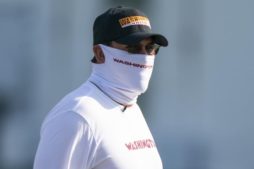 Washington head coach Ron Rivera arrives for practice wearing a face mask, at the team's NFL football training facility, Thursday, Aug. 20, 2020, in Ashburn, Va. (AP Photo/Alex Brandon)