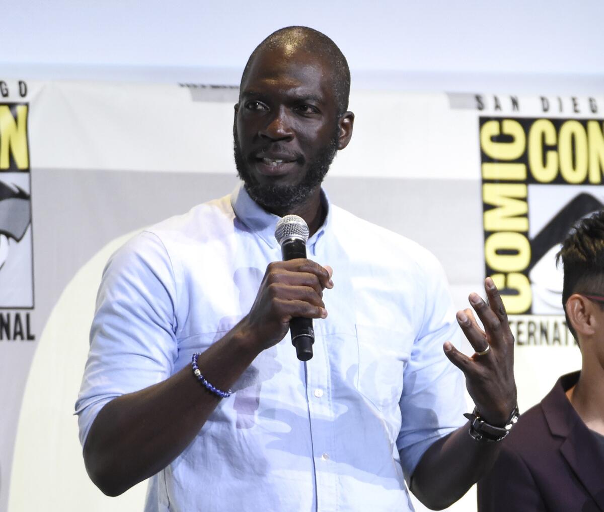 Director Rick Famuyiwa speaks during the "Justice League" panel at Comic-Con International in San Diego on July 23.