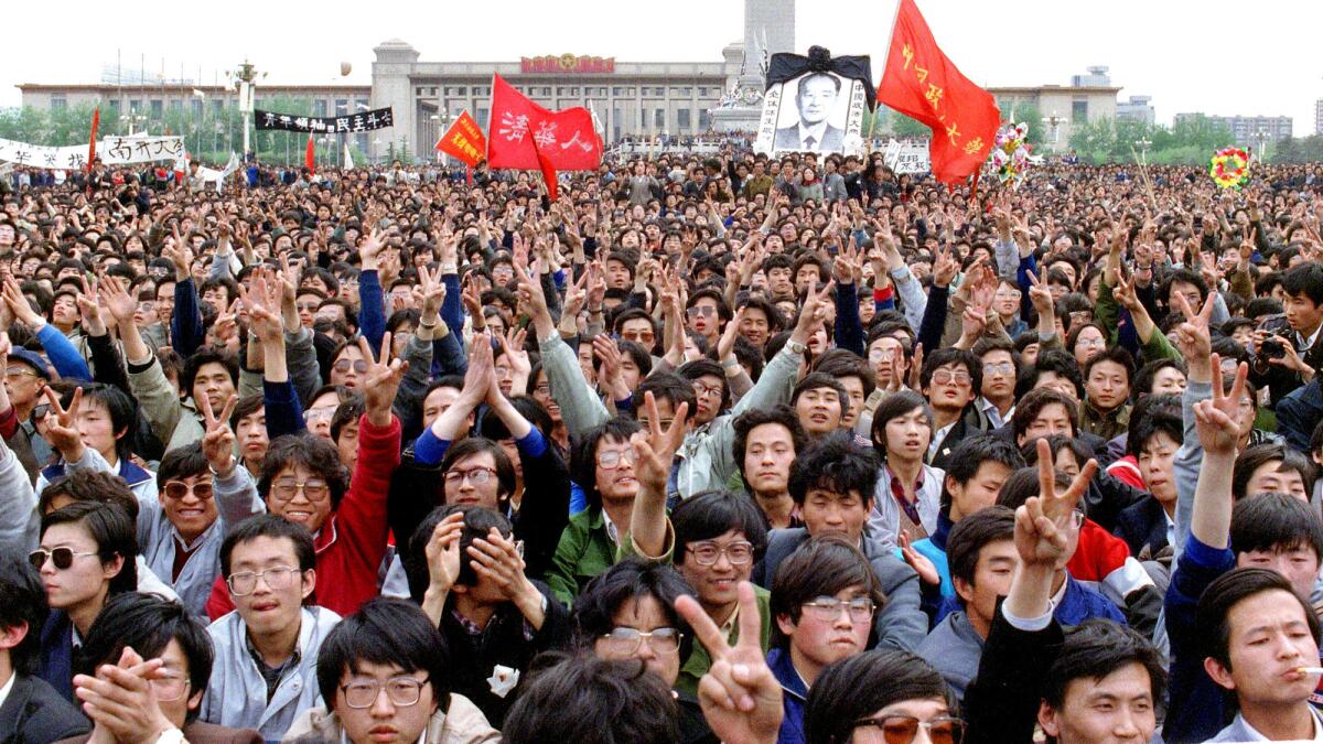 Students shout slogans in support of former Communist Party leader and reformer Hu Yaobang, whose death in April 1989 triggered an unprecedented wave of pro-democracy demonstrations.