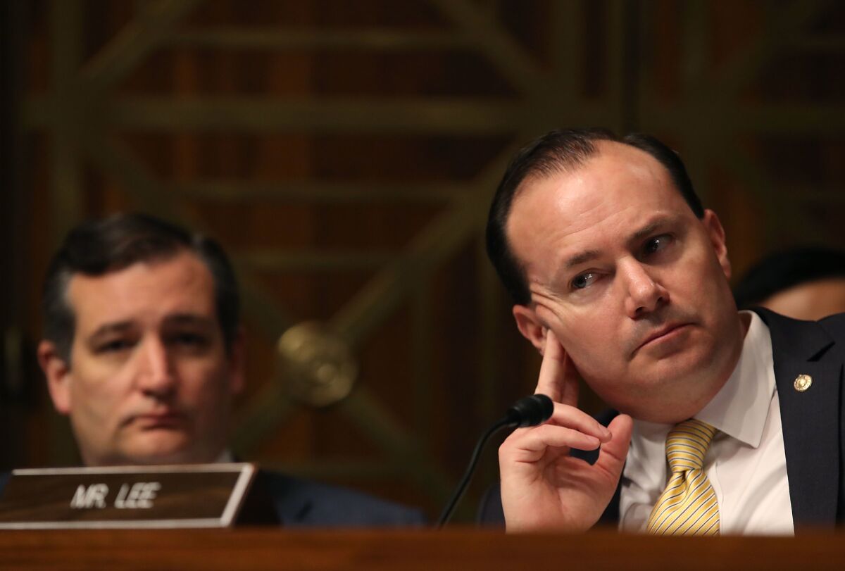 Sen. Mike Lee (R-Utah), right, and Sen. Ted Cruz (R-Texas) are members of a four-person group who have reservations with the Senate healthcare bill as it is currently written.