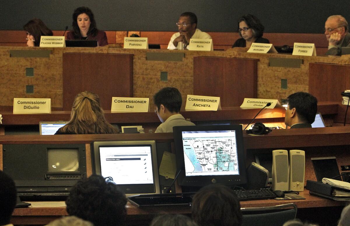 Commissioners in June 2011 listen to public comment at Culver City Hall on a newly drawn congressional redistricting map.