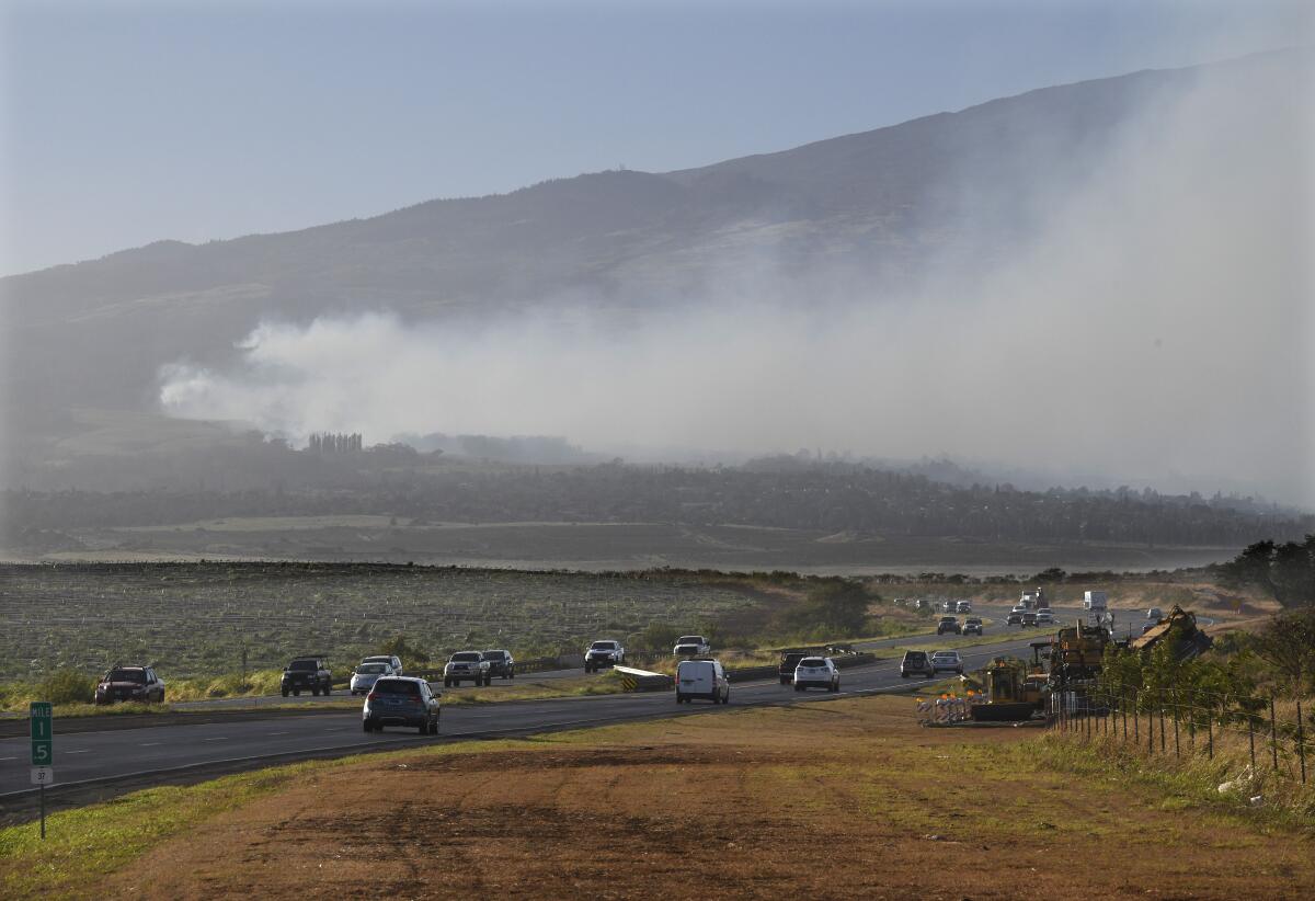 Smoke blows across the slope of Haleakala volcano on Maui, Hawaii.
