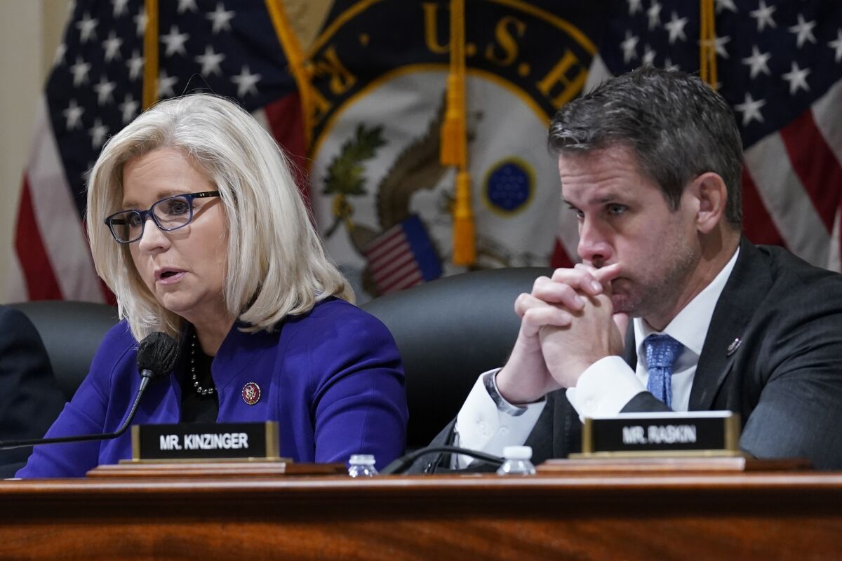 Rep. Liz Cheney (R-Wyo.), and Rep. Adam Kinzinger (R-Ill.) listen during a House select committee meeting in October.