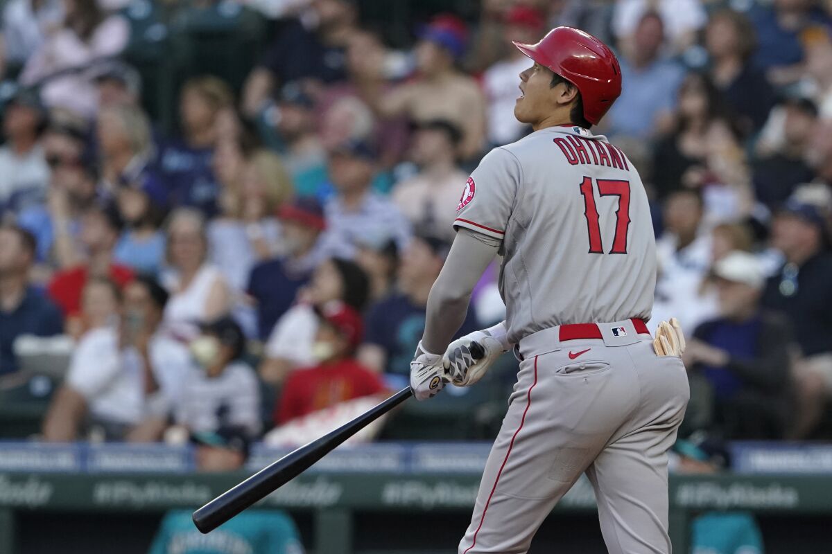Shohei Ohtani watches his a solo home run during the third inning against the Seattle Mariners on Friday.