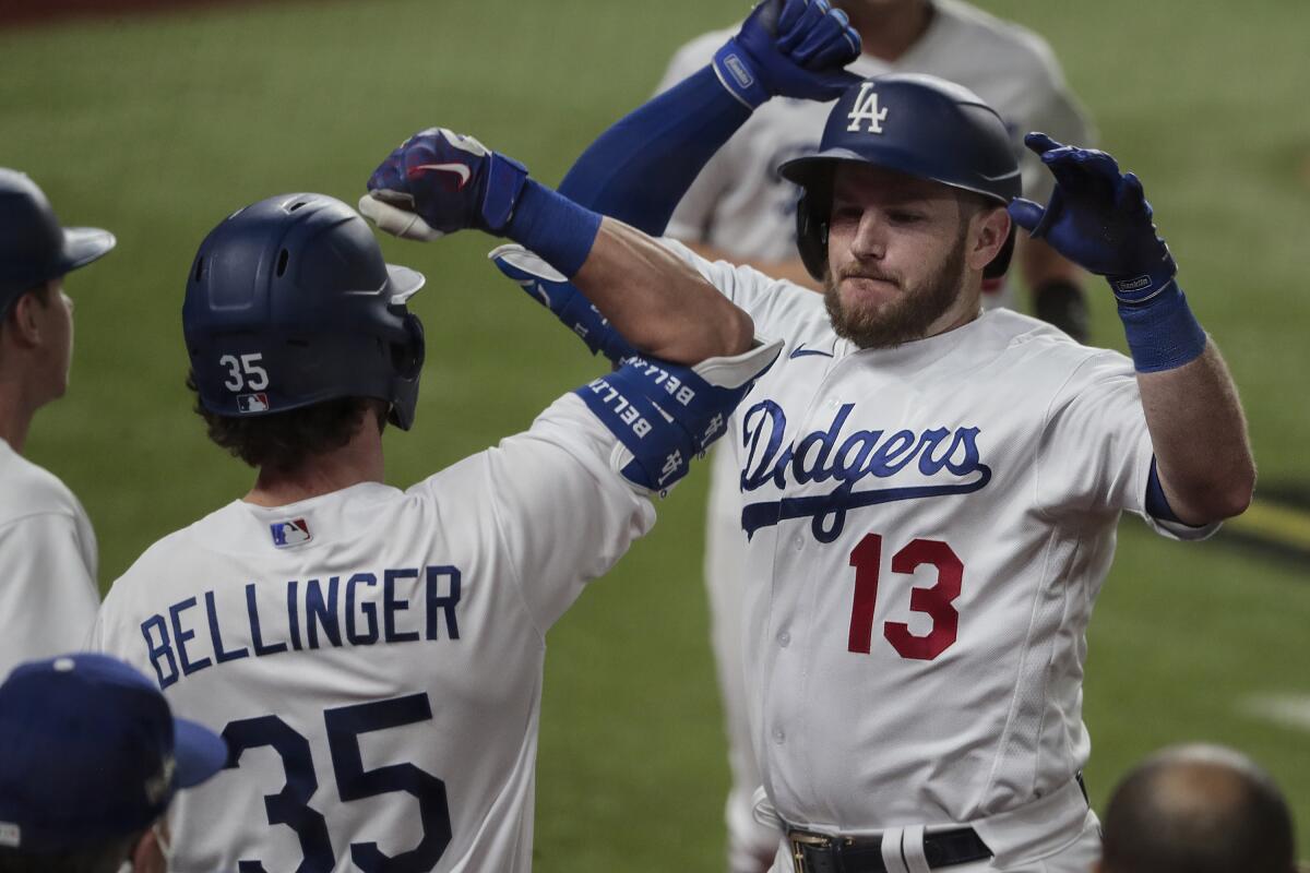 Dodgers first baseman Max Muncy celebrates after hitting a two-run, ninth-inning home run against the Atlanta Braves.