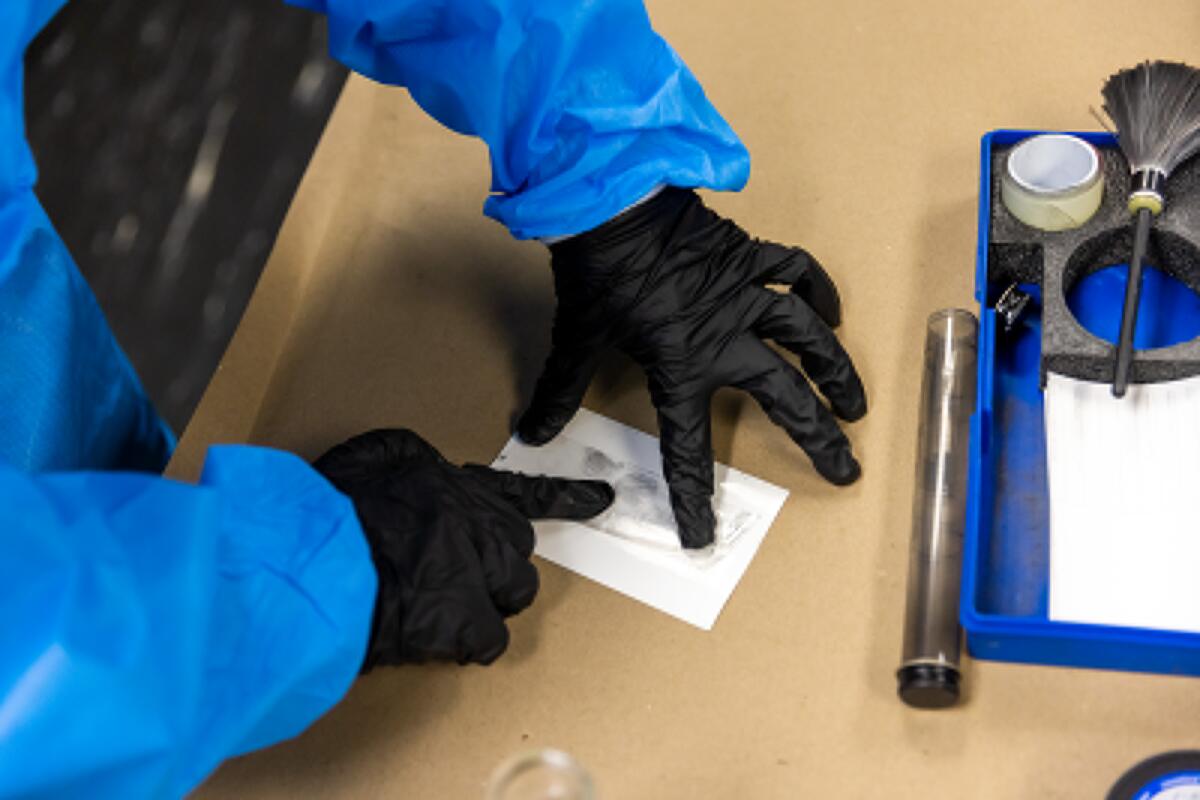 Fingerprints being lifted during a session of the Costa Mesa Citizen's Police Academy on Thursday.