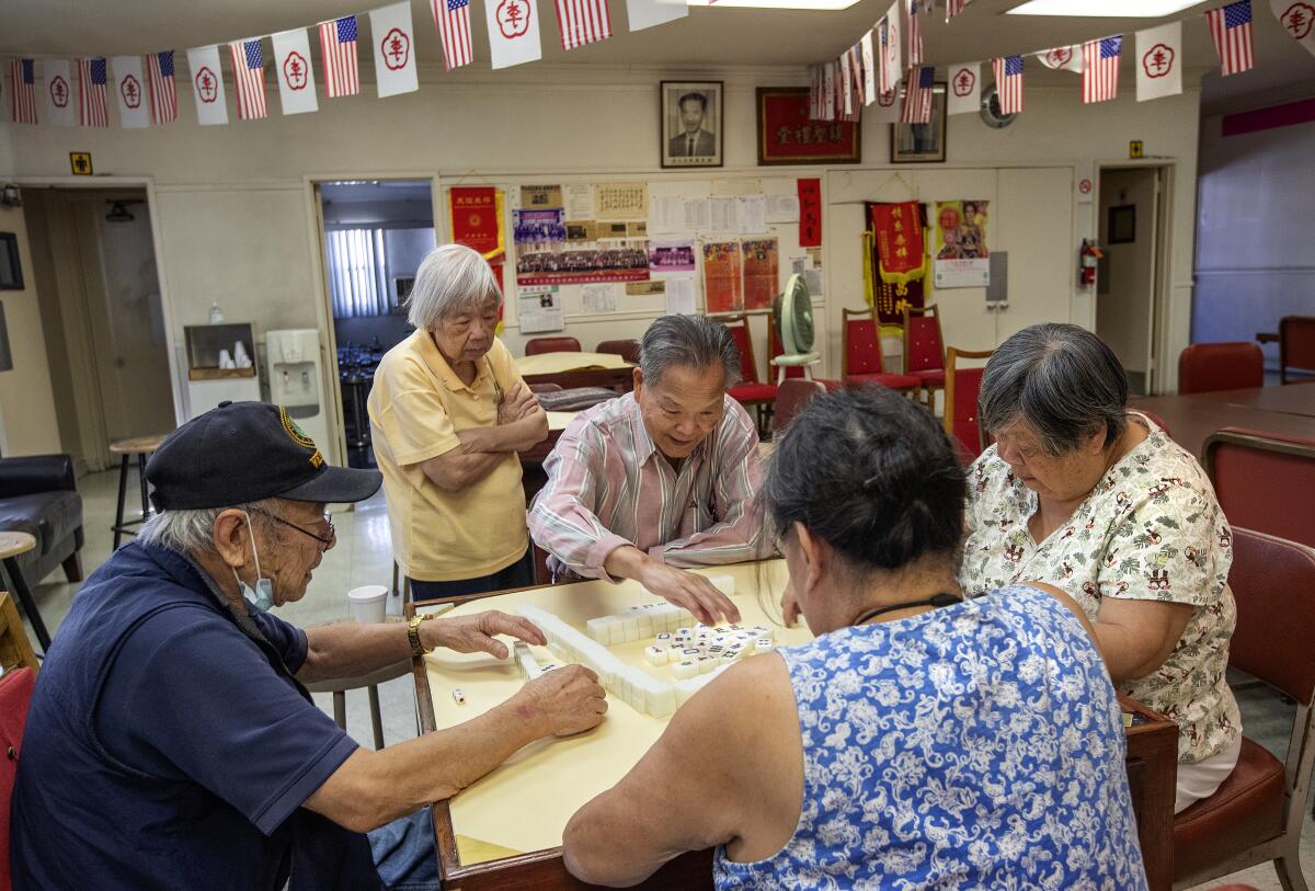 From left, Bill Fong, 88; Suey Lee, 85; Rose Wong, 71and Aileen Lee play mah-jongg.