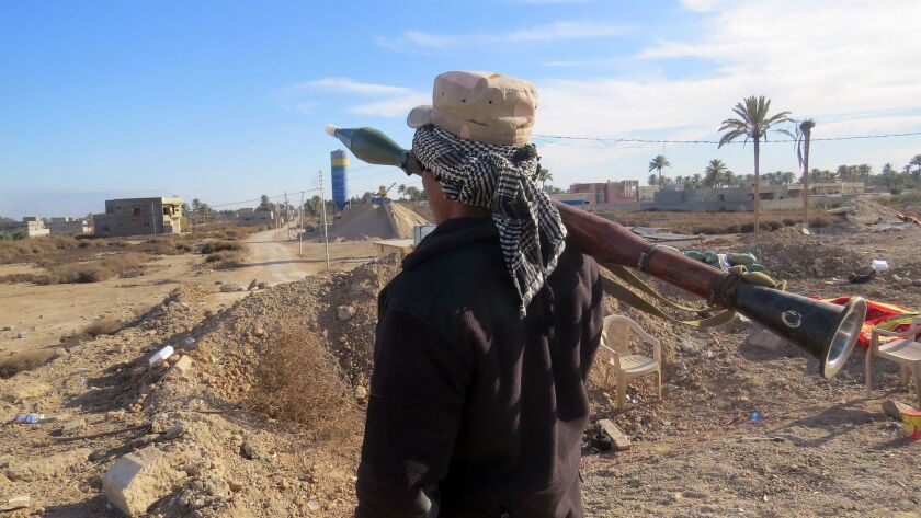 A member of the Iraqi security forces holds a rocket-propelled-grenade launcher Jan. 17 during an operation to clear the Sajarya district on the eastern outskirts of Ramadi of Islamic State fighters.
