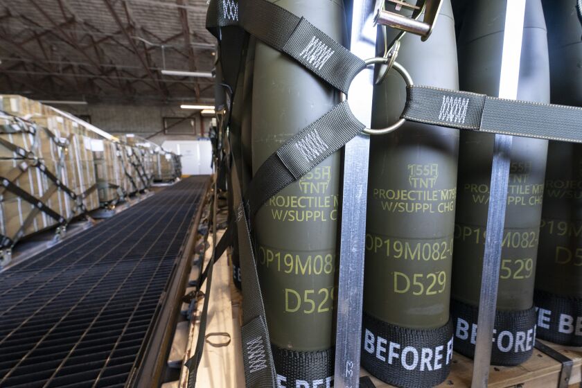 FILE - Pallets of 155 mm shells ultimately bound for Ukraine are loaded by the 436th Aerial Port Squadron, April 29, 2022, at Dover Air Force Base, Del. U.S. officials say a military aid package for Ukraine that is expected to be announced this week will total up to $300 million, and will include additional munitions for drones. (AP Photo/Alex Brandon, File)