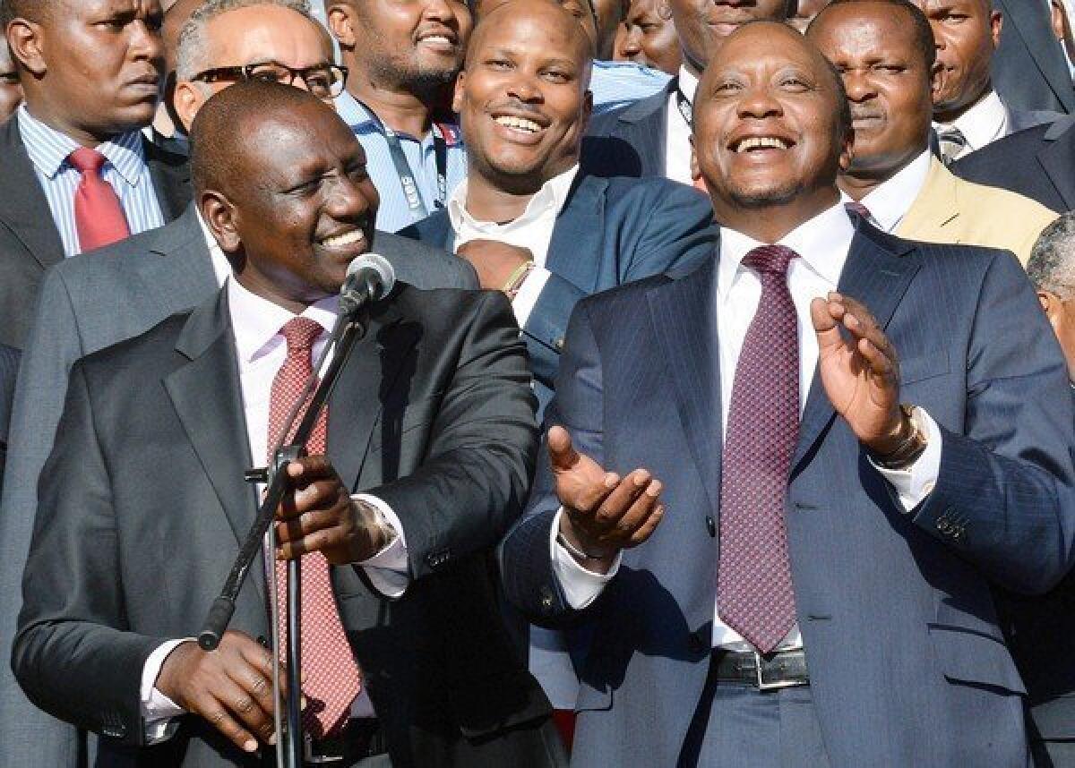 Newly elected Kenyan President Uhuru Kenyatta, right, and running mate William Ruto celebrate their victory at a rally in Nairobi.