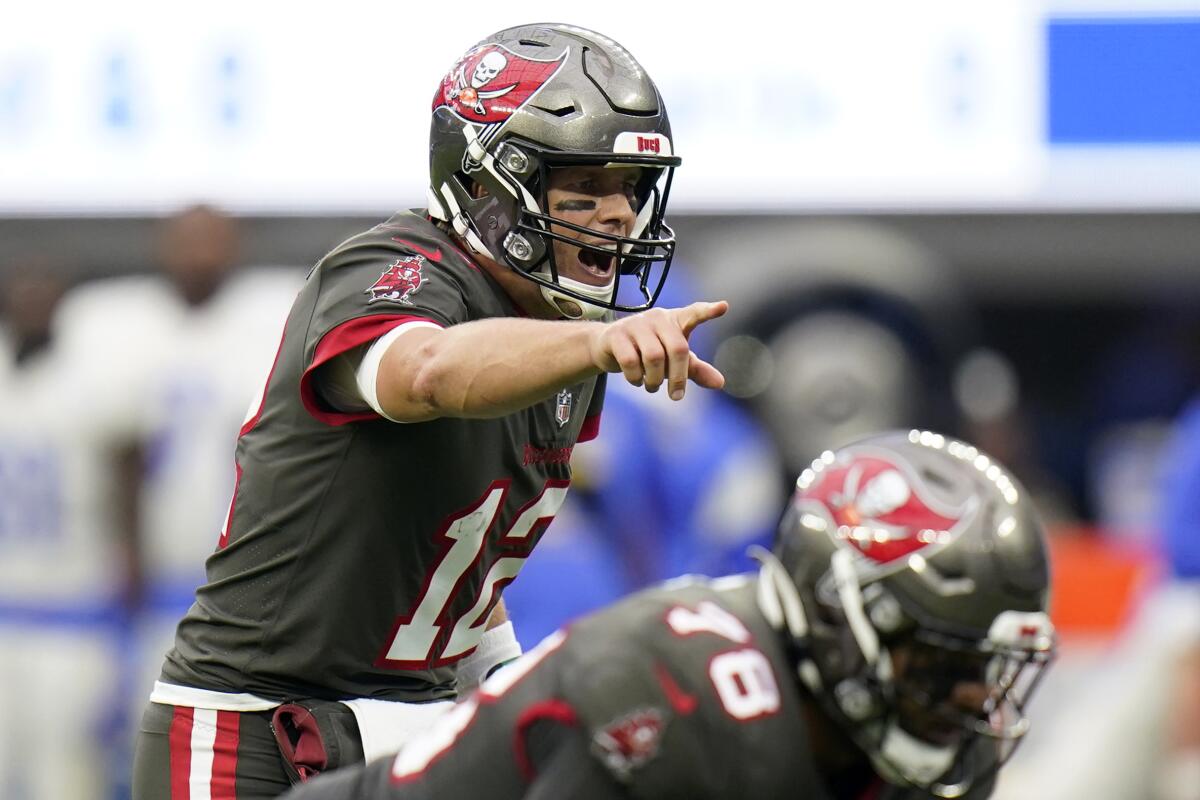 Tampa Bay Buccaneers quarterback Tom Brady signals during the second half of an NFL football game against the Rams