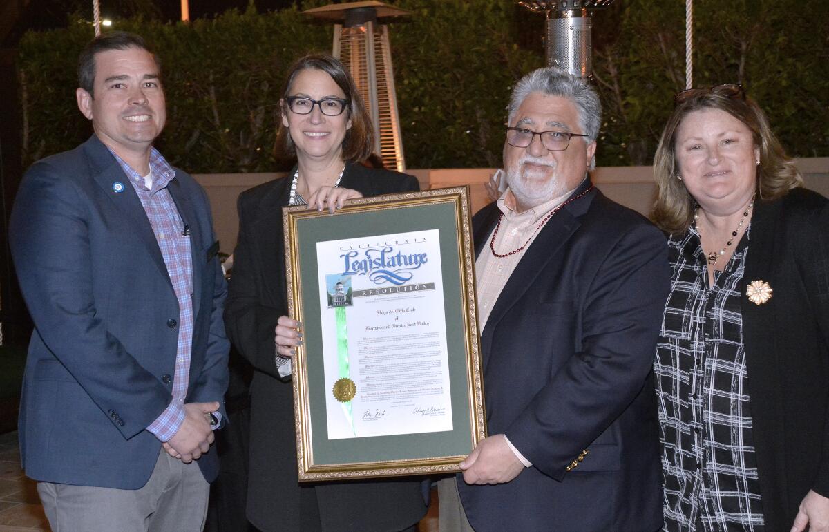State Sen. Anthony Portantino and Assemblywoman Laura Friedman, center, presented Shanna Warren, the Boys & Girls Club's chief executive, and Paul Herman, the club president, with a joint resolution to honor the club’s 25th anniversary.