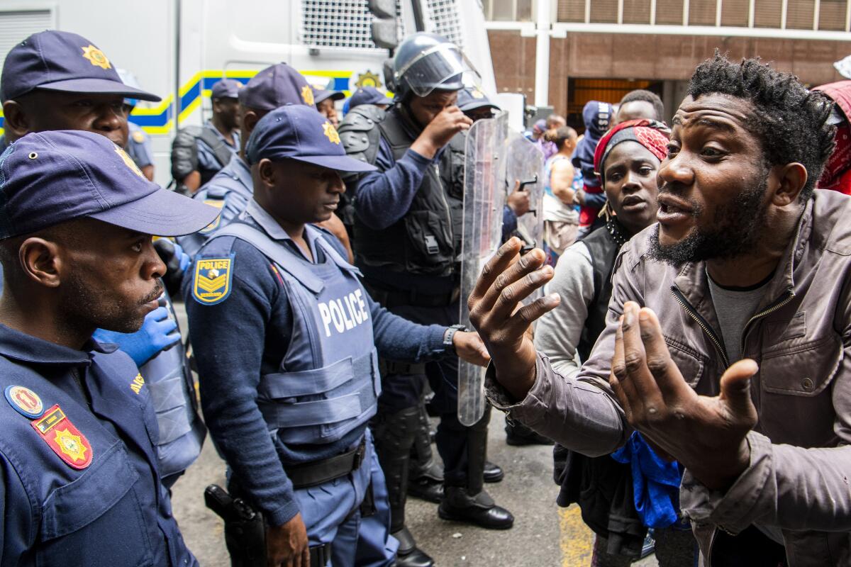 Police clash with protesters outside the U.N. refugee agency's offices in Cape Town, South Africa, on Oct. 30.