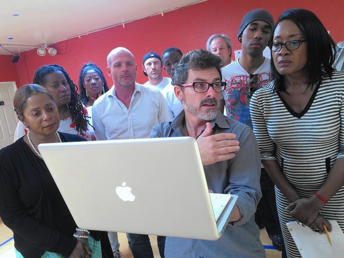 Director Nick DeGruccio discusses the play "Ferguson," by Phelim McAleer, with actors during rehearsal. Some cast members have quit in protest over the play's depiction of Michael Brown's shooting by a Missouri police officer.