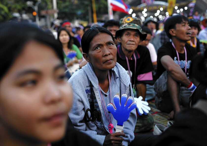 Antigovernment protesters listen to a speech in Bangkok, Thailand.