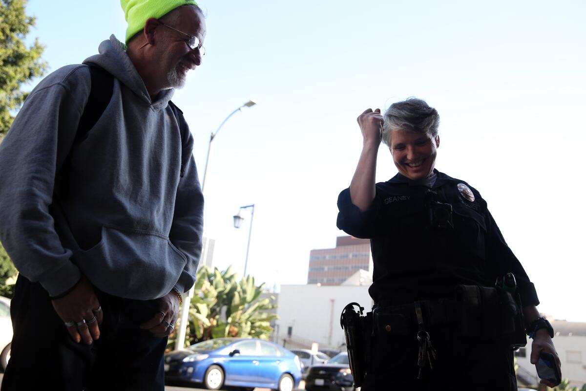 LA Times Columnist, Steve Lopez, checks the tires of LA City Deputy News  Photo - Getty Images