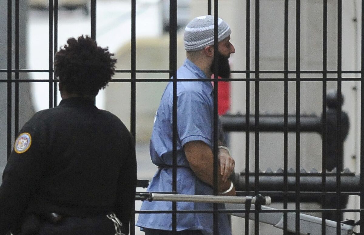 FILE - In this Feb. 3, 2016 file photo, Adnan Syed enters Courthouse East prior to a hearing in Baltimore. Baltimore prosecutors and attorneys for Syed, a Maryland man whose murder conviction was chronicled in the podcast “Serial” are seeking a new look at the case. The prosecutors signed on to a motion Thursday, March 10, 2022, that asks a judge to order a retest of some evidence in the case against Adnan Syed, The Baltimore Sun reported.(Barbara Haddock Taylor/The Baltimore Sun via AP, File)