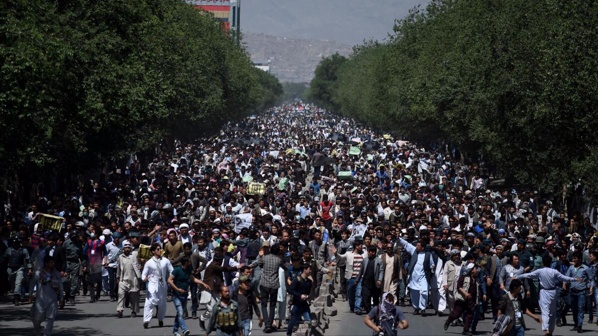 Afghans led by members of the Hazara ethnic minority took to the streets of Kabul on May 16, 2016, to protest the controversial rerouting of a new power line away from Bamiyan province, which has a large Hazara population.
