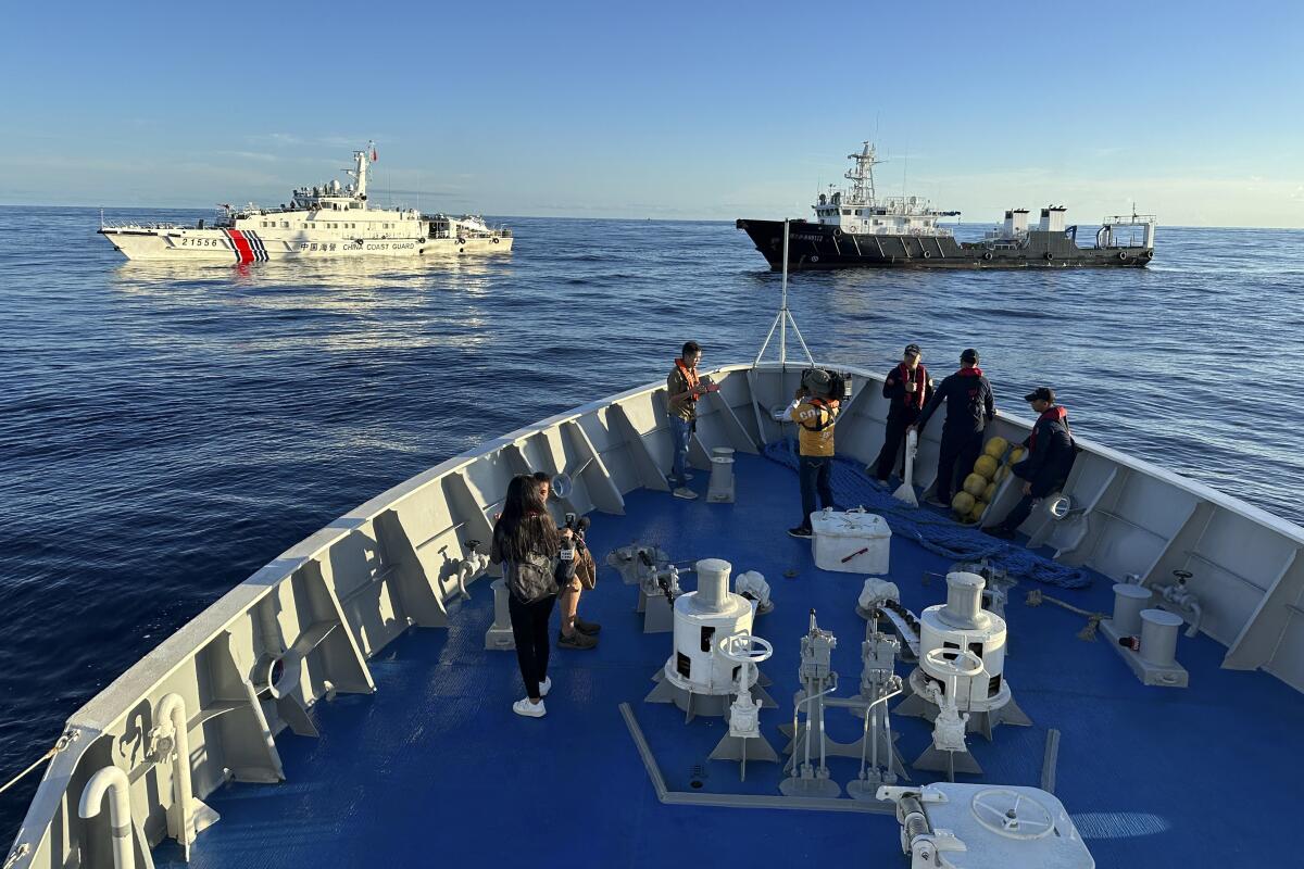 Chinese coast guard and suspected Chinese militia ship block the Philippine coast guard ship BRP Cabra 