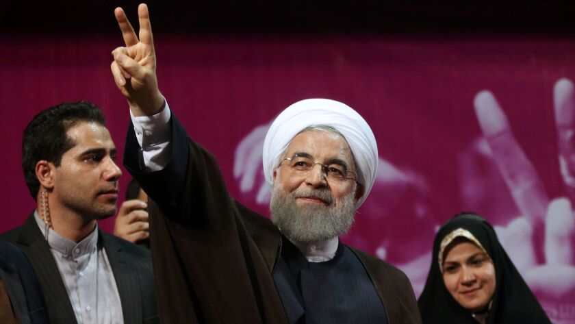 Iranian President Hassan Rouhani concludes his speech at a campaign rally in Tehran preceding the upcoming presidential election.