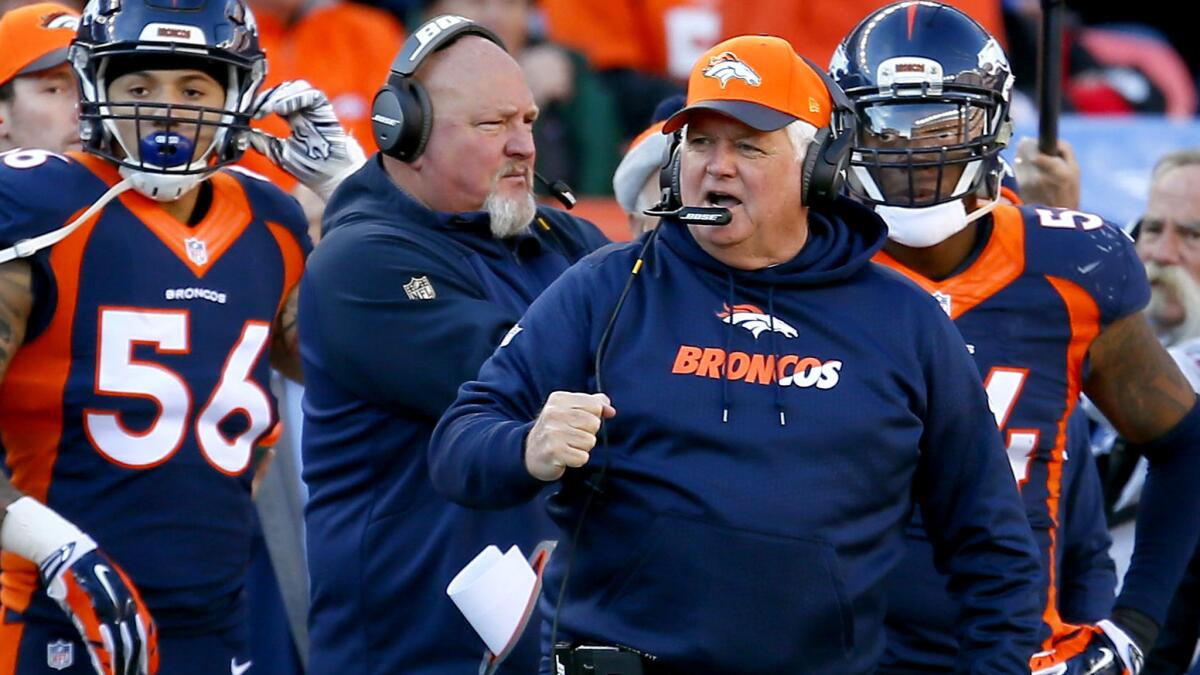 Broncos defensive coordinator Wade Phillips reacts after a play against the Raiders during a game in December.