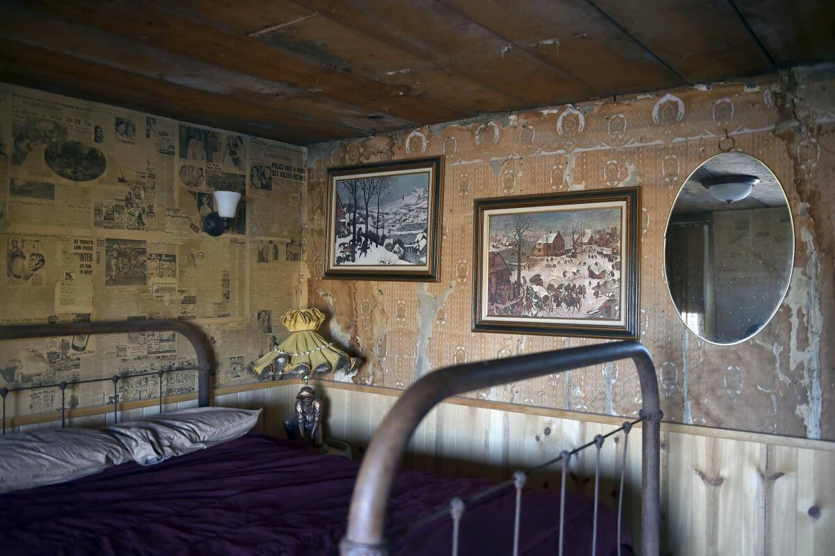 Historic newspapers and other vintage items decorate one the guest rooms in Gold Point, Nev.