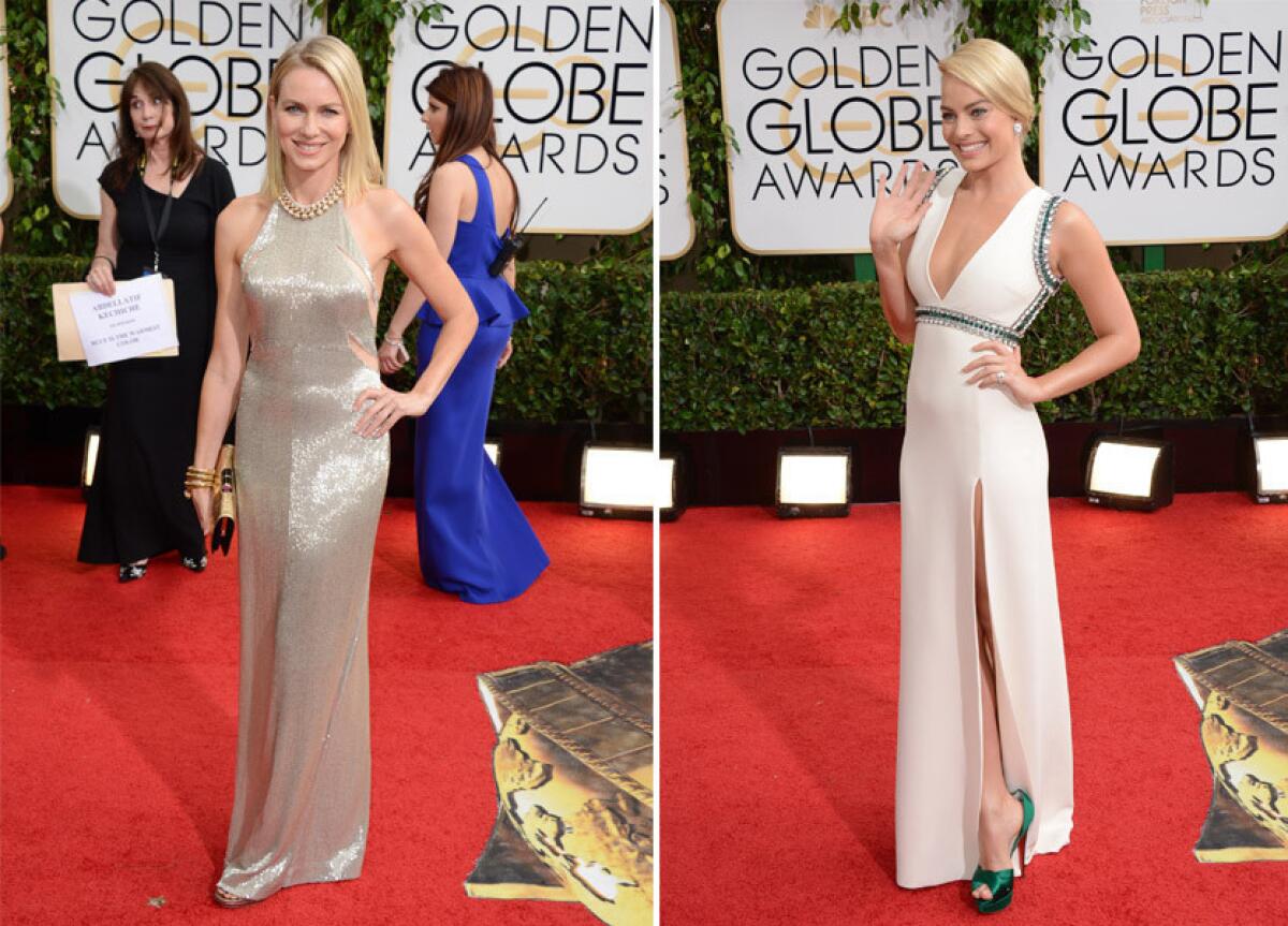 The red carpet fashion choices are showing a lack of color. Actress Naomi Watts, left, is wearing a silver Tom Ford gown, while actress Margot Robbie is wearing a white silk crepe Gucci gown.