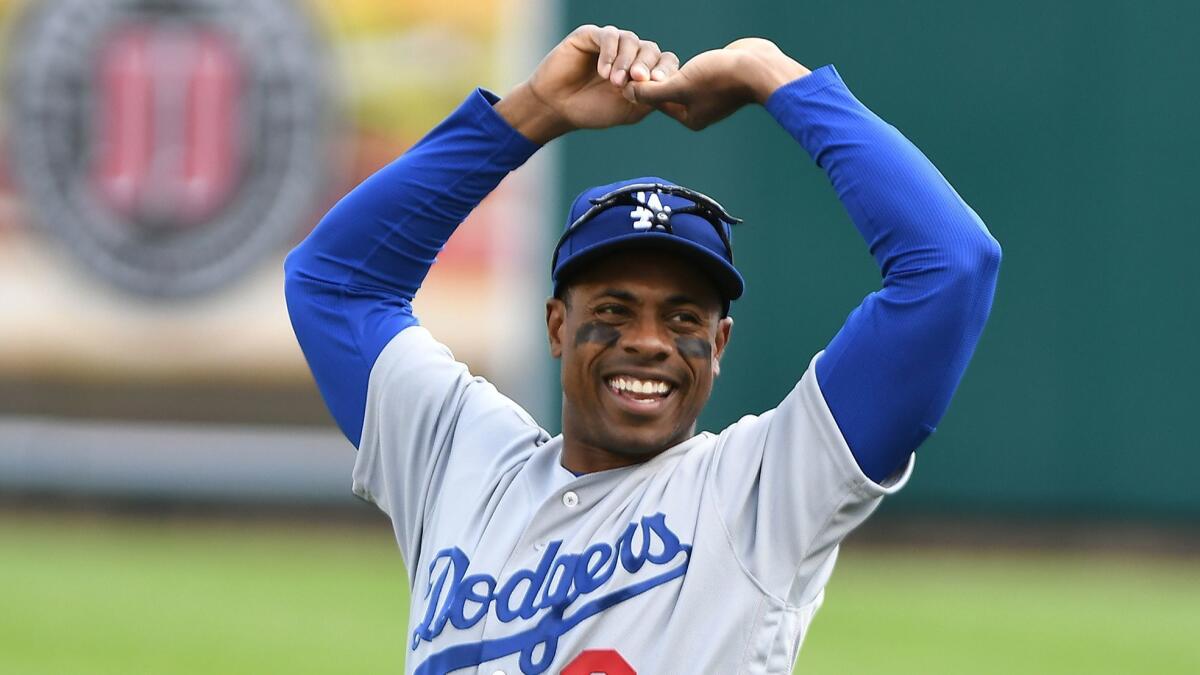 Outfielder Curtis Granderson stretches before his first game with the Dodgers on Saturday.