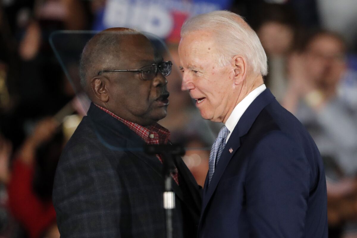  Joe Biden talks to Rep. James Clyburn at a rally in Columbia, South Carolina, in 2020. 