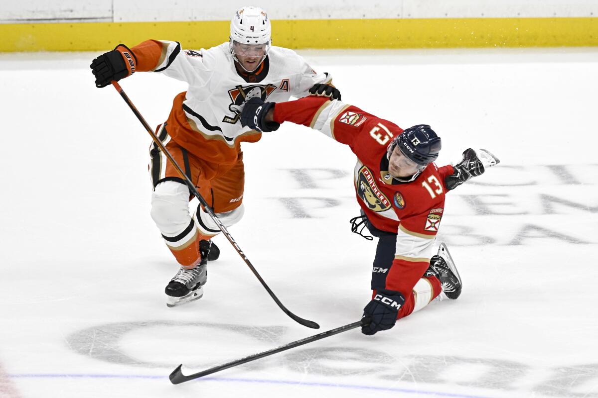 Ducks defenseman Cam Fowler, left, is called for a penalty after tripping up Florida Panthers forward Sam Reinhart.